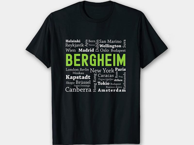 Schwarzes T Shirt mit Wort Wolke und dem Wort Bergheim in grün